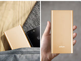 12000mAh Power Bank in gold aluminum alloy design, ultra-thin and portable for efficient charging.